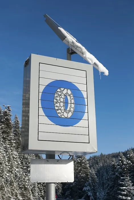 Framed Print : Solar-powered traffic sign indicating the use of snow chains