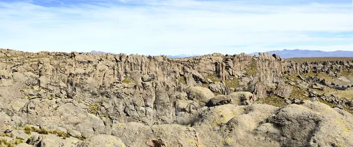 Framed Print : The solid Peruvian mountain wall consists of many porous vertical aged red granite stones