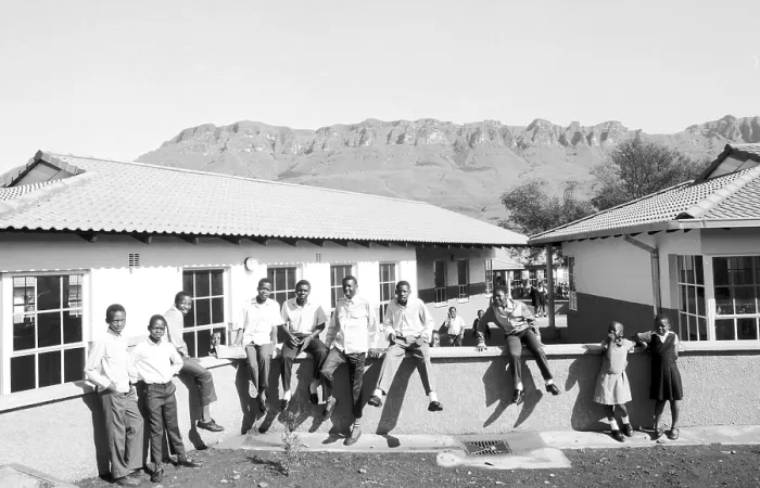Framed Print : South Africa: Panoramic View of the Drakensberg Mountains and a Black School Building