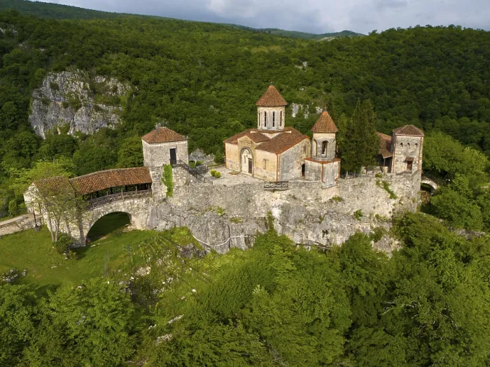 Framed Print : Spacious monastery structure on a rock surrounded by forest landscape