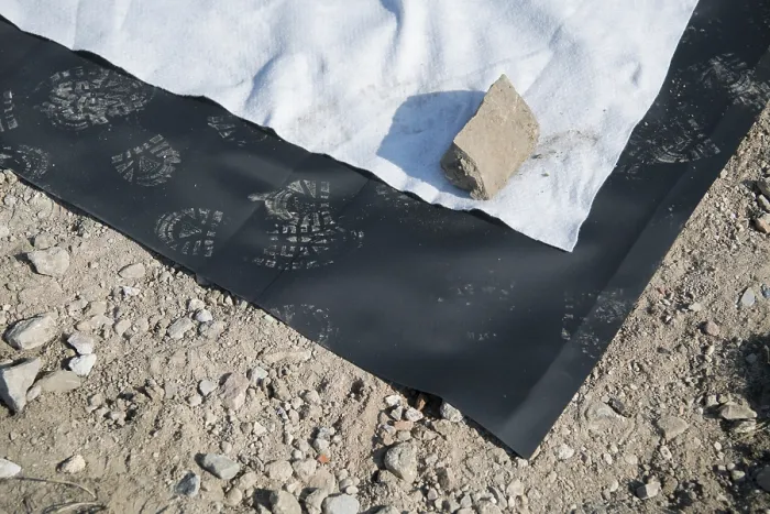 Framed Print : Species protection, close-up of foil laid out in hole for spawning waters for amphibians
