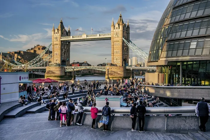 Framed Print : Spectators at The Scoop amphitheatre with London City Hall and Tower Bridge over the Thames in the evening sun