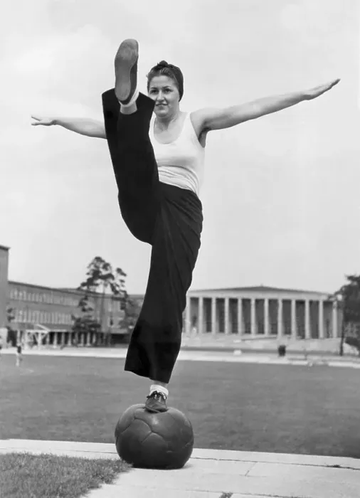 Framed Print : Sport, woman balancing on a medicine ball Framed Print : Sport, woman balancing on a medicine ball