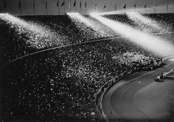 Framed Print : The spotlights chase beams of light over the crowds Framed Print : The spotlights chase beams of light over the crowds