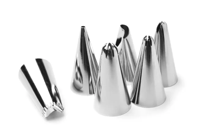 Framed Print : Spouts for icing syringe on white background