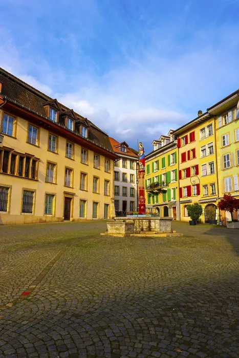Framed Print : Square in Old Town with House and Water Fountain with Statue Justice