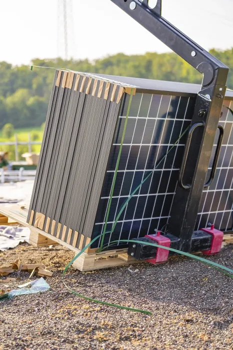 Framed Print : Stacked solar panels on pallets with lifting gear outdoors Framed Print : Stacked solar panels on pallets with lifting gear outdoors