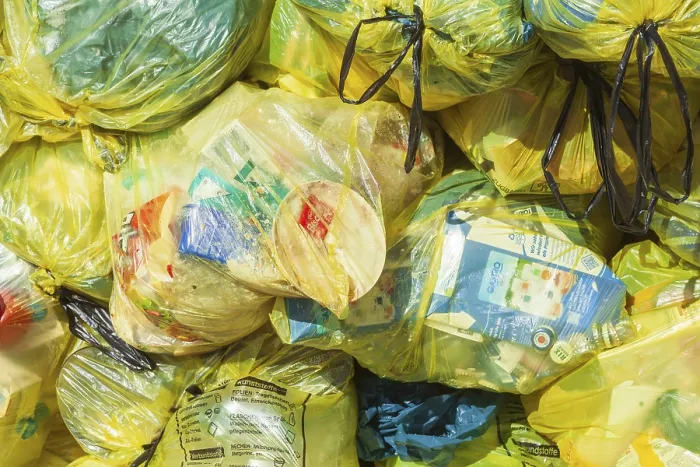 Framed Print : Stacked yellow bags for plastic waste, Germany