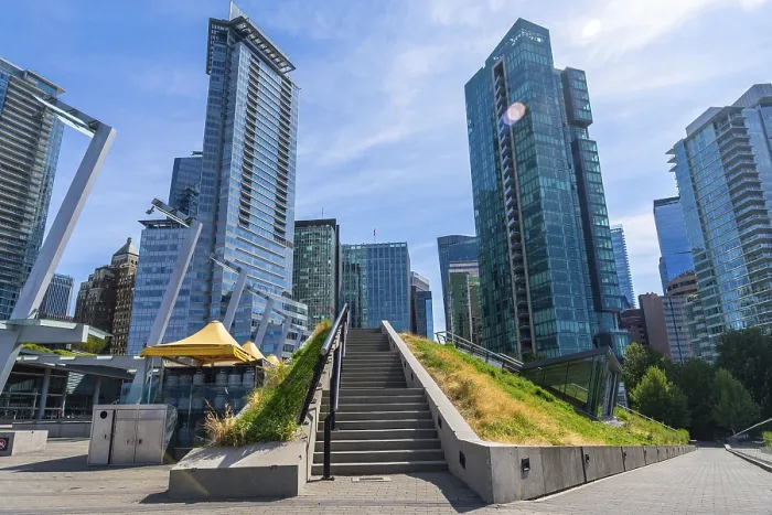 Framed Print : Stairs leading up a grassy knoll with modern skyscrapers towering above in the heart of vancouver Framed Print : Stairs leading up a grassy knoll with modern skyscrapers towering above in the heart of vancouver
