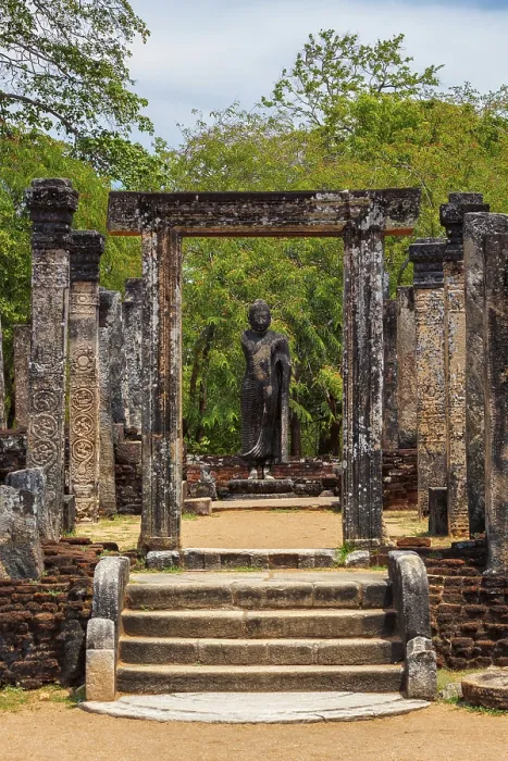 Framed Print : Standing Buddha statue in ancient ruins