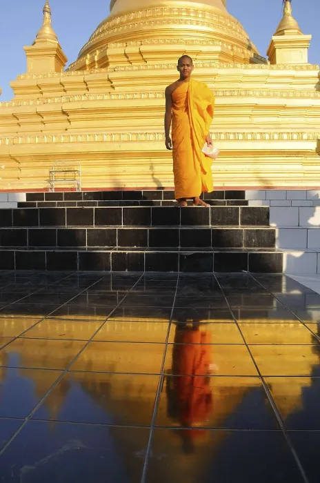 Framed Print : Standing Buddhist monk being reflected in front of the Kuthodaw Pagoda in Mandalay Framed Print : Standing Buddhist monk being reflected in front of the Kuthodaw Pagoda in Mandalay