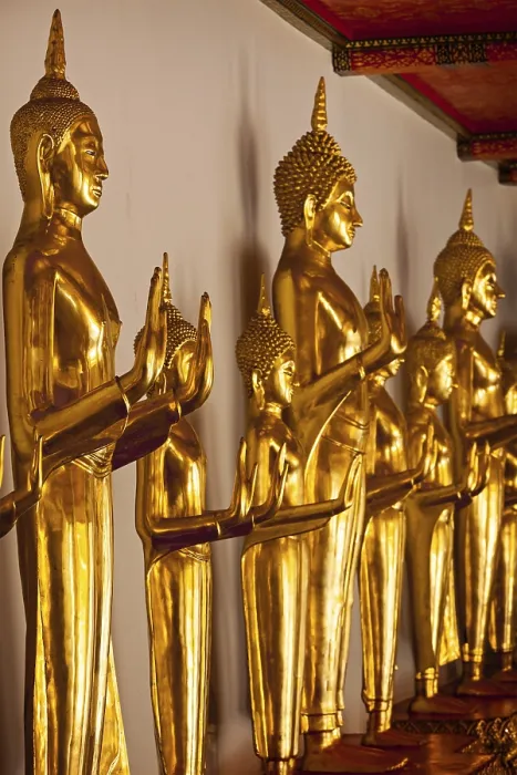 Framed Print : Standing golden Buddha statues close up