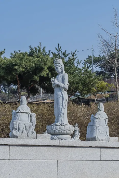 Framed Print : Standing stone carved Buddha in prayer under blue sky in Pyeongtaek Framed Print : Standing stone carved Buddha in prayer under blue sky in Pyeongtaek