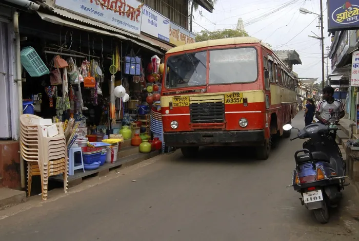 Framed Print : State transport bus, driving through very narrow road