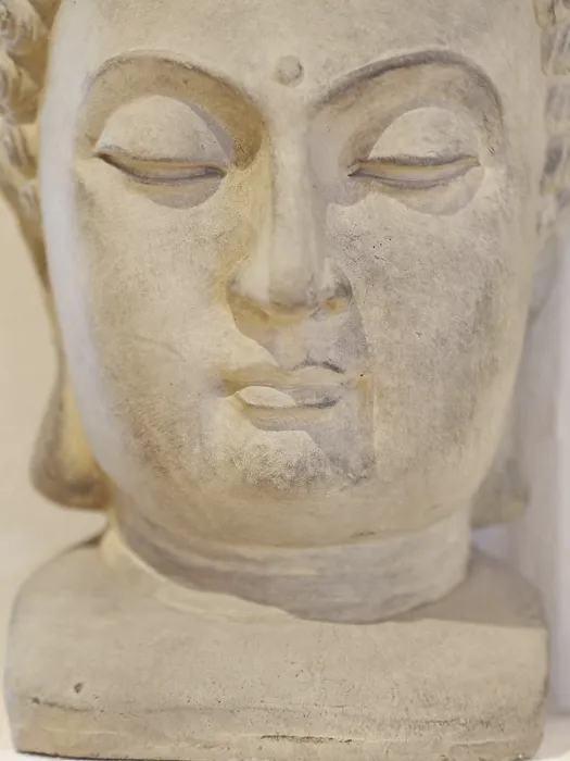 Framed Print : A statue of a face with a serene expression Framed Print : A statue of a face with a serene expression