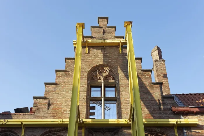Framed Print : Steel girders support staircase gable of a historic house facade Framed Print : Steel girders support staircase gable of a historic house facade
