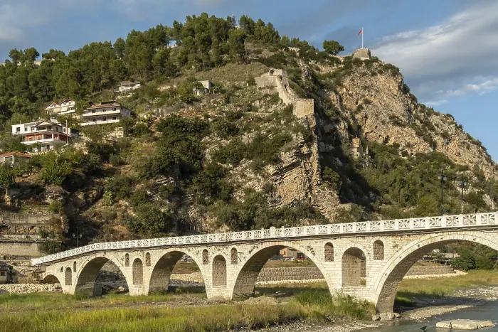 Framed Print : Steep fortress with old city wall across river bridge