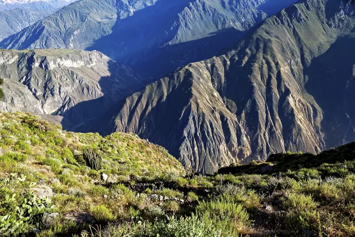 Framed Print : Steep mountain valleys with lush vegetation and distinctive shadows