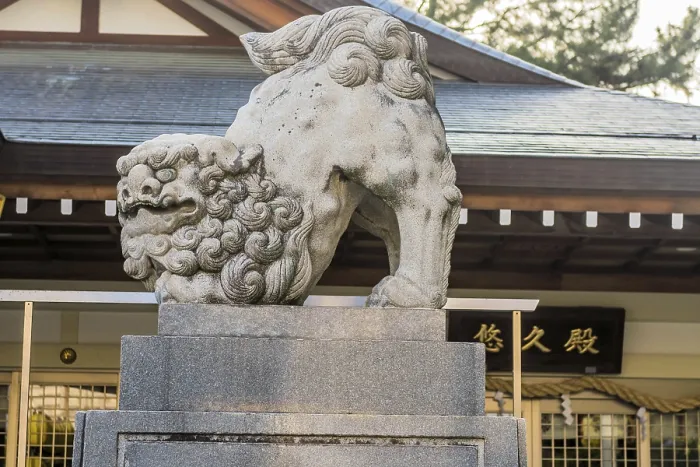 Framed Print : Stone carved lion in front of Shinto Temple building in Hiroshima