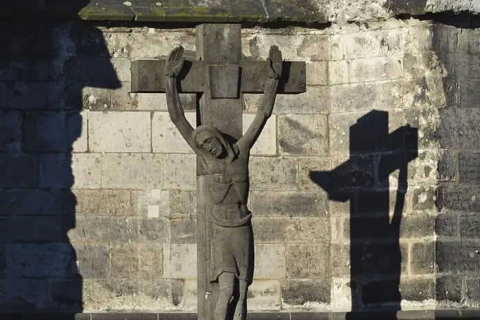 Framed Print : Stone cross with shadow cast, cathedral cemetery near Cologne Cathedral
