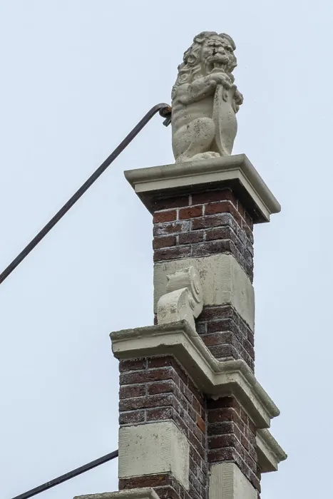 Framed Print : Stone lion on medieval gable and house roof in the netherlands Framed Print : Stone lion on medieval gable and house roof in the netherlands