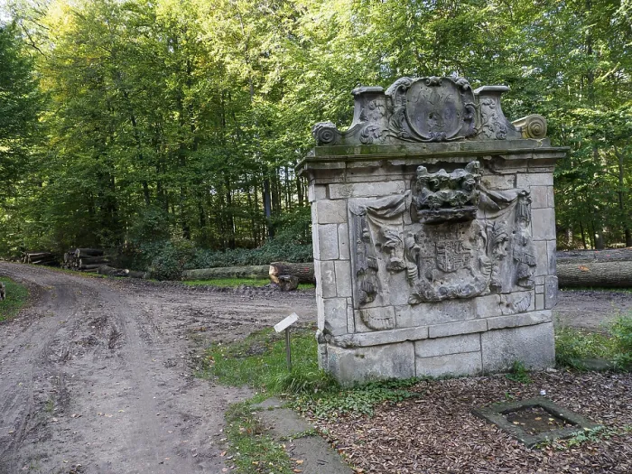 Framed Print : Stone monument at the edge of a forest along a path Framed Print : Stone monument at the edge of a forest along a path