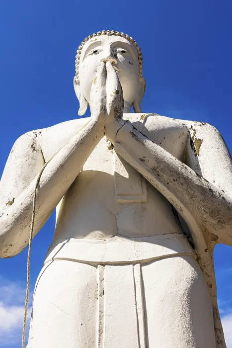Framed Print : Stone praying white Buddha statue Framed Print : Stone praying white Buddha statue