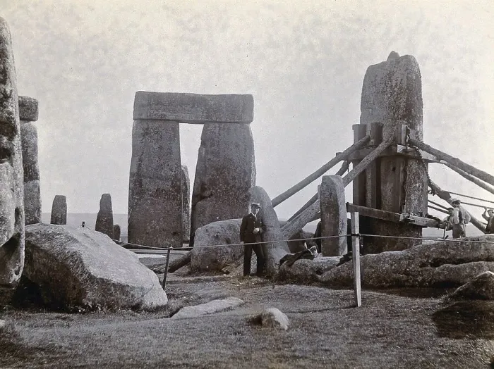 Framed Print : Stonehenge, England. Straightening of a leaning stone attached to a wooden frame and supported by beams: erected