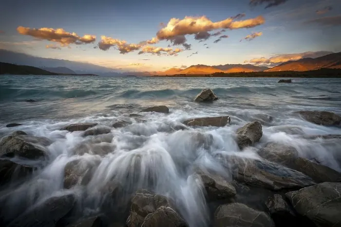 Framed Print : Stones on shore, lake with sunset swell Framed Print : Stones on shore, lake with sunset swell