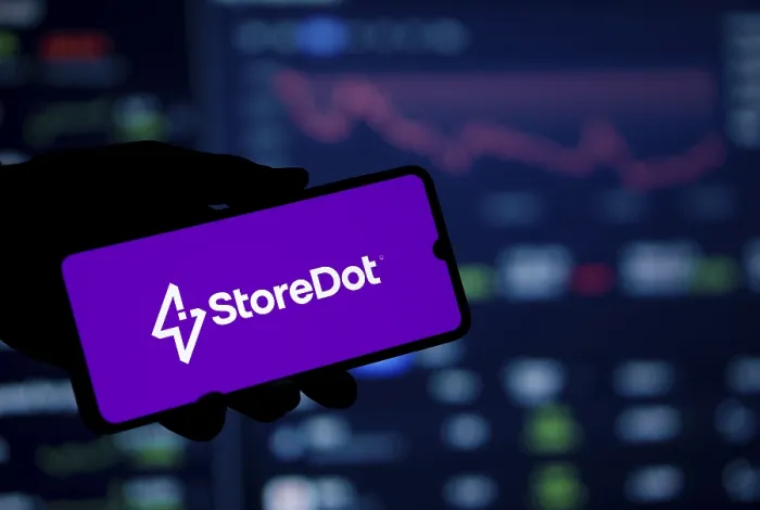 Framed Print : storedot logo is displayed on smartphone