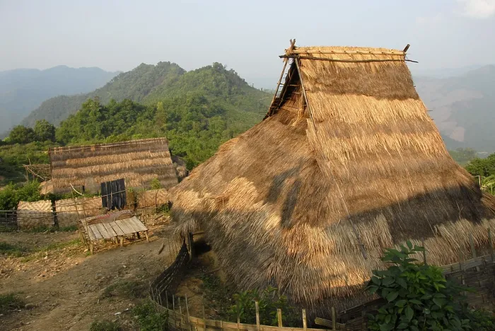 Framed Print : Straw roofed bamboo huts of the ethnic Akha people in a traditional mountain village
