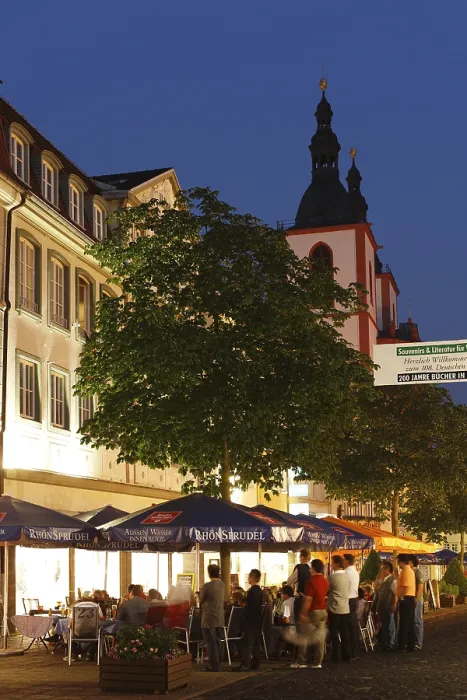 Framed Print : Street cafe in Friedrichstrasse and the town parish church