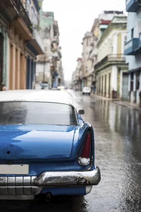 Framed Print : Street scene with old car on rainy day in Havana
