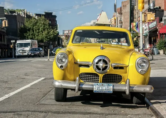 Framed Print : Studebaker Champion, Tacotaxi, Vintage Yellow Cab in front of the restaurant Caliente Cab