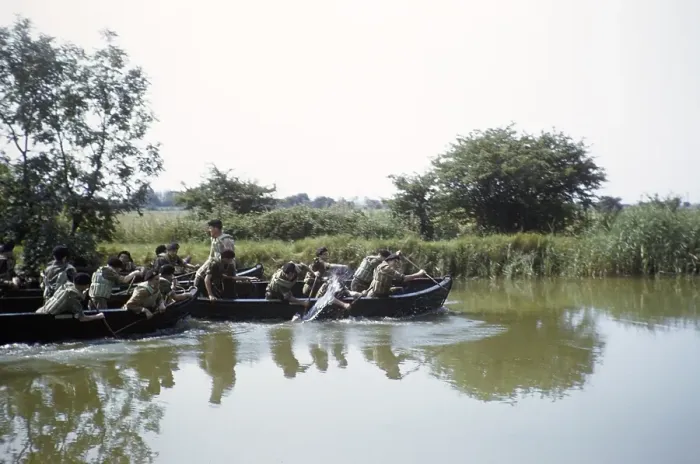 Framed Print : Students taking part in military exercises as army cadets, South of England, United Kingdom, late 1950s, paddling in boats on a river, Europe