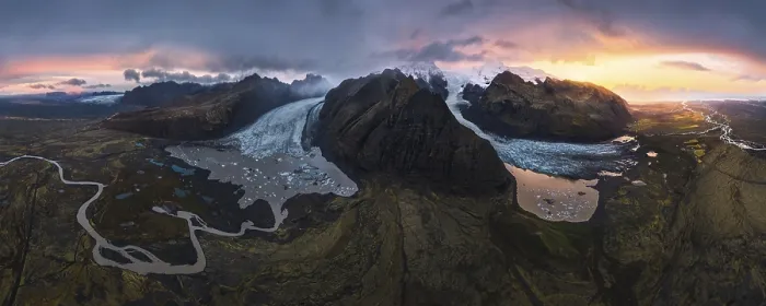 Framed Print : A stunning aerial view of a glacier cascading between volcanic mountains