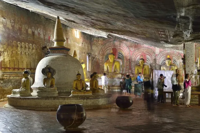 Framed Print : Stupa, Buddha statues and murals in one of the cave temples of the Golden Temple