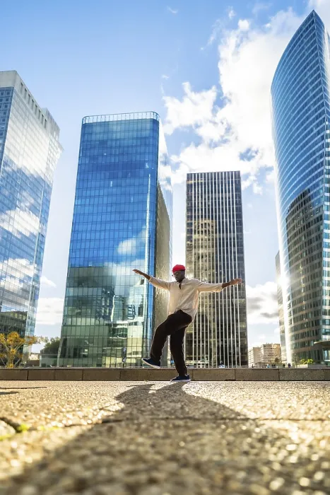 Framed Print : Stylish black man balancing on one leg with outstretched arms