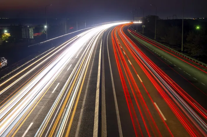 Framed Print : Suburban highway at night. Traces from headlights and taillights of heavy traffic Framed Print : Suburban highway at night. Traces from headlights and taillights of heavy traffic