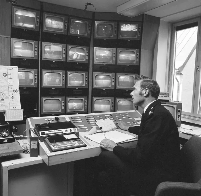 Framed Print : Subway safety in the 1970s. The feed from the subway surveillance cameras are monitored Framed Print : Subway safety in the 1970s. The feed from the subway surveillance cameras are monitored