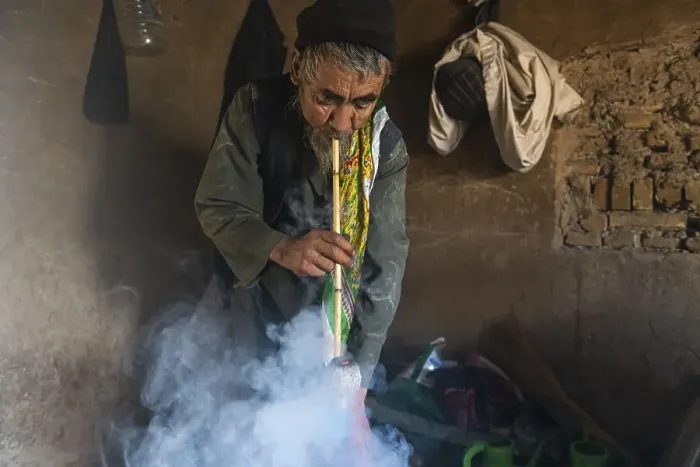 Framed Print : Sufi man smoking marihuana, Balkh