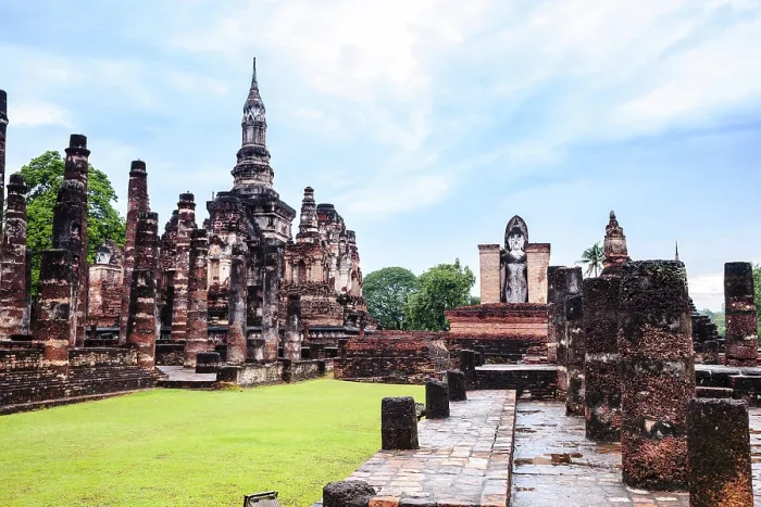Framed Print : Sukhothai style chedi and standing buddha image in sukhothai historical park