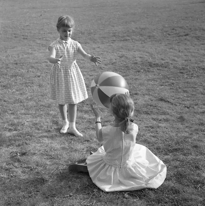 Framed Print : Summer activitiy in the 1950s. Two girls are playing with a ball on a summers dag 1957 Framed Print : Summer activitiy in the 1950s. Two girls are playing with a ball on a summers dag 1957