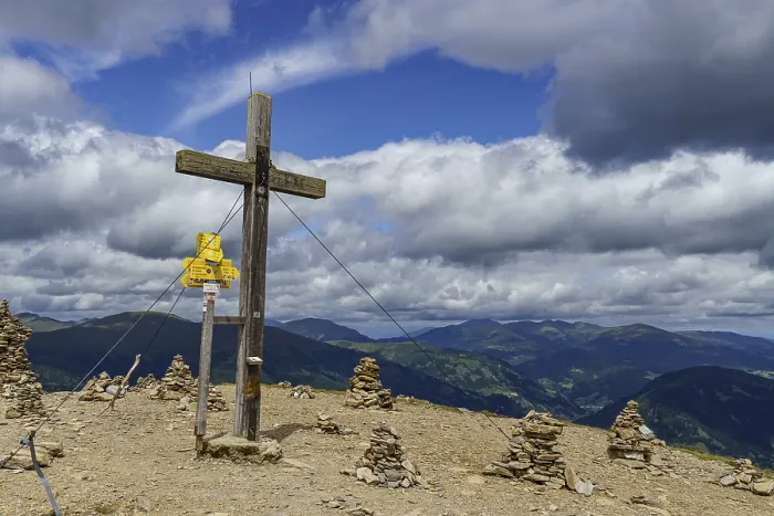 Framed Print : Summit cross with stone men and clouds in the sky Framed Print : Summit cross with stone men and clouds in the sky