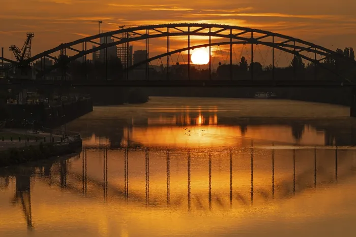 Framed Print : The sun rises behind the Deutschherrn Bridge Framed Print : The sun rises behind the Deutschherrn Bridge