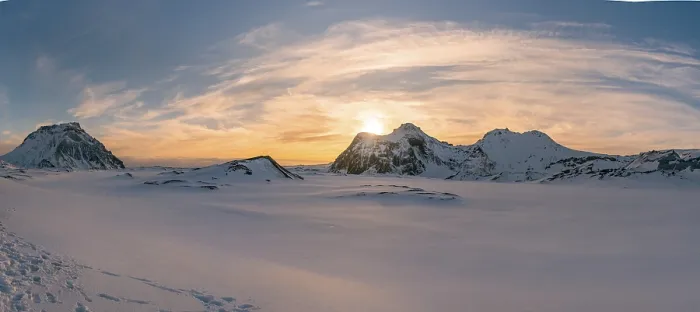 Framed Print : The sun sets behind the rugged