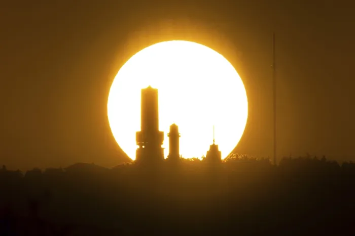 Framed Print : The sun sets behind the towers on the summit of the GroBer Feldberg in the Taunus