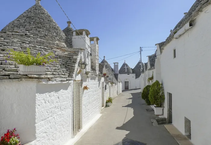 Framed Print : Sunny impression of trulli houses at a town named Alberobello in Apulia