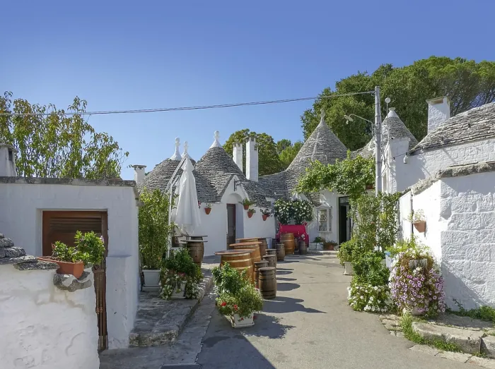 Framed Print : Sunny impression of trulli houses at a town named Alberobello in Apulia