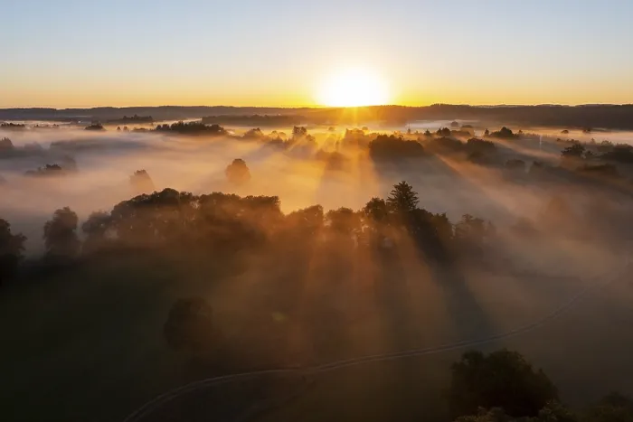 Framed Print : Sunrise with fog over cultivated landscape